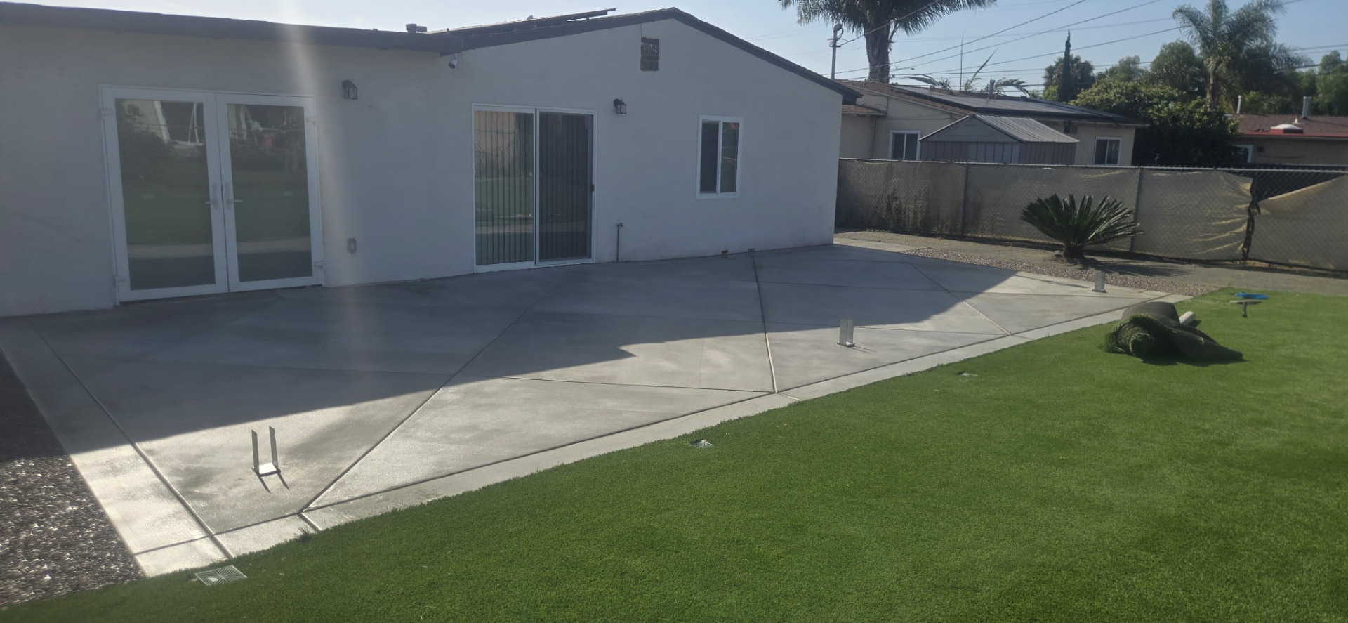 Large finished concrete backyard patio at a San Diego home